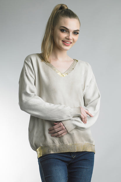 Women's lightweight v-neck sweater with metallic trim at neck and waist