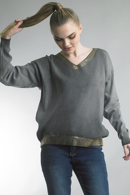 Women's lightweight v-neck sweater with metallic trim at neck and waist